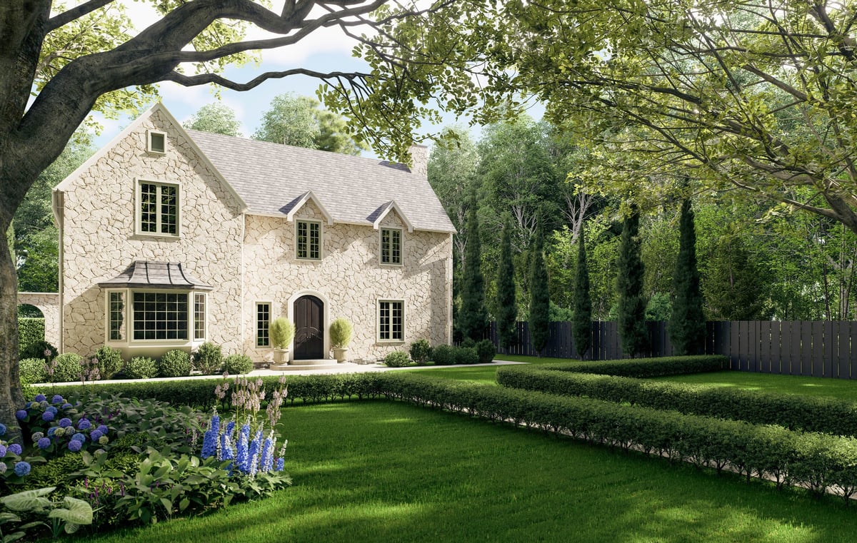 Luxury stone manor house with a beautifully landscaped garden and manicured lawn